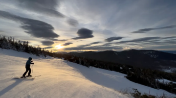 As the sun begins to set, a skier starts their last run of the day at Sugarloaf in Carrabassett Valley on January 18. Gregory Rec/Staff Photographer